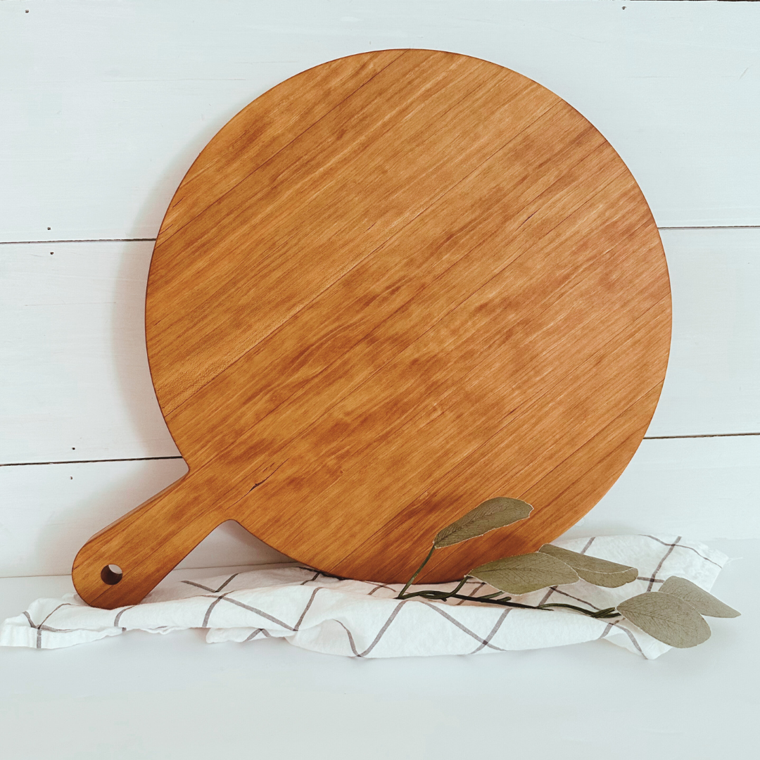 cherry wood shaped pizza board
