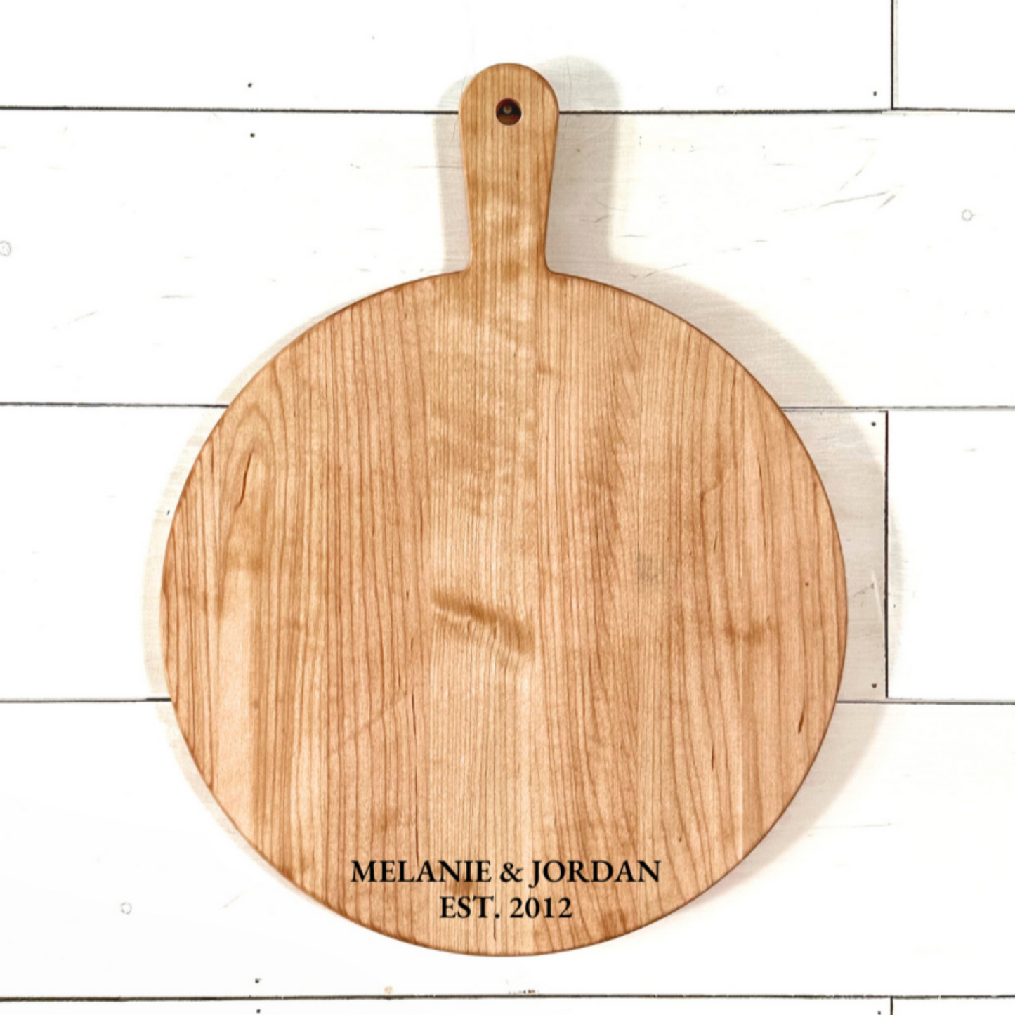 a double-sided wooden board for pizza and charcuterie, suitable for weddings, realtors, housewarmings, and more.