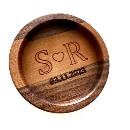 wooden wine coaster with intricate engraving initials and wedding date