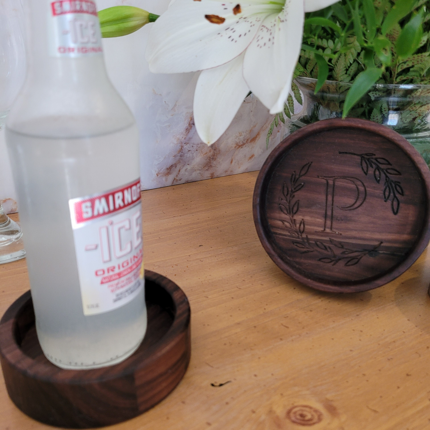 wooden wine coaster with intricate engraving wreath and initial