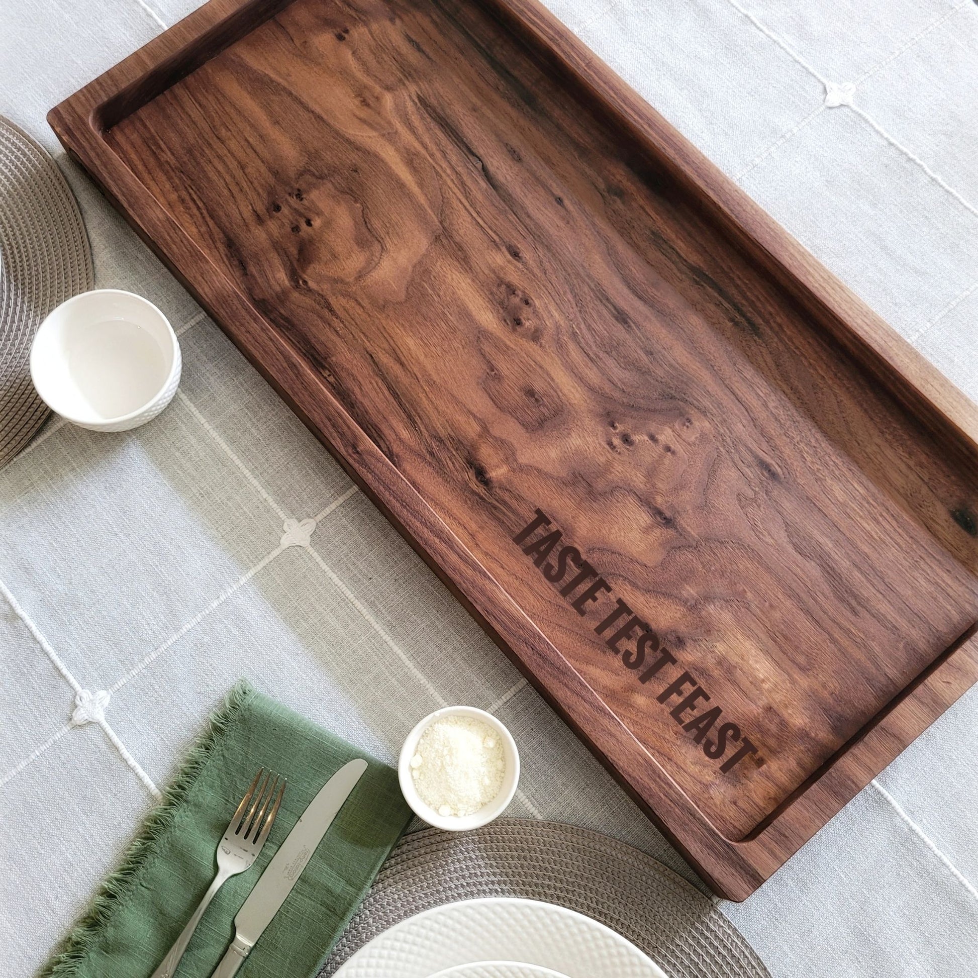 large walnut charcuterie board personalized with a custom message