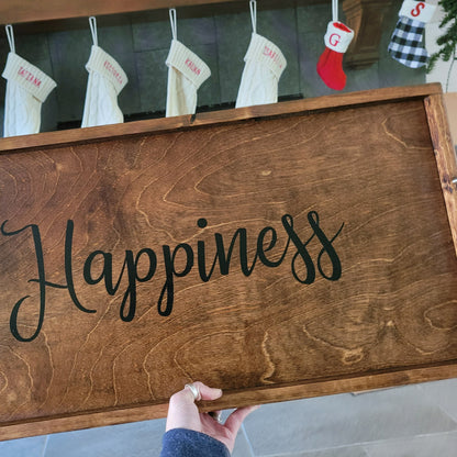 large charcuterie tray with handles, with the word happiness on it