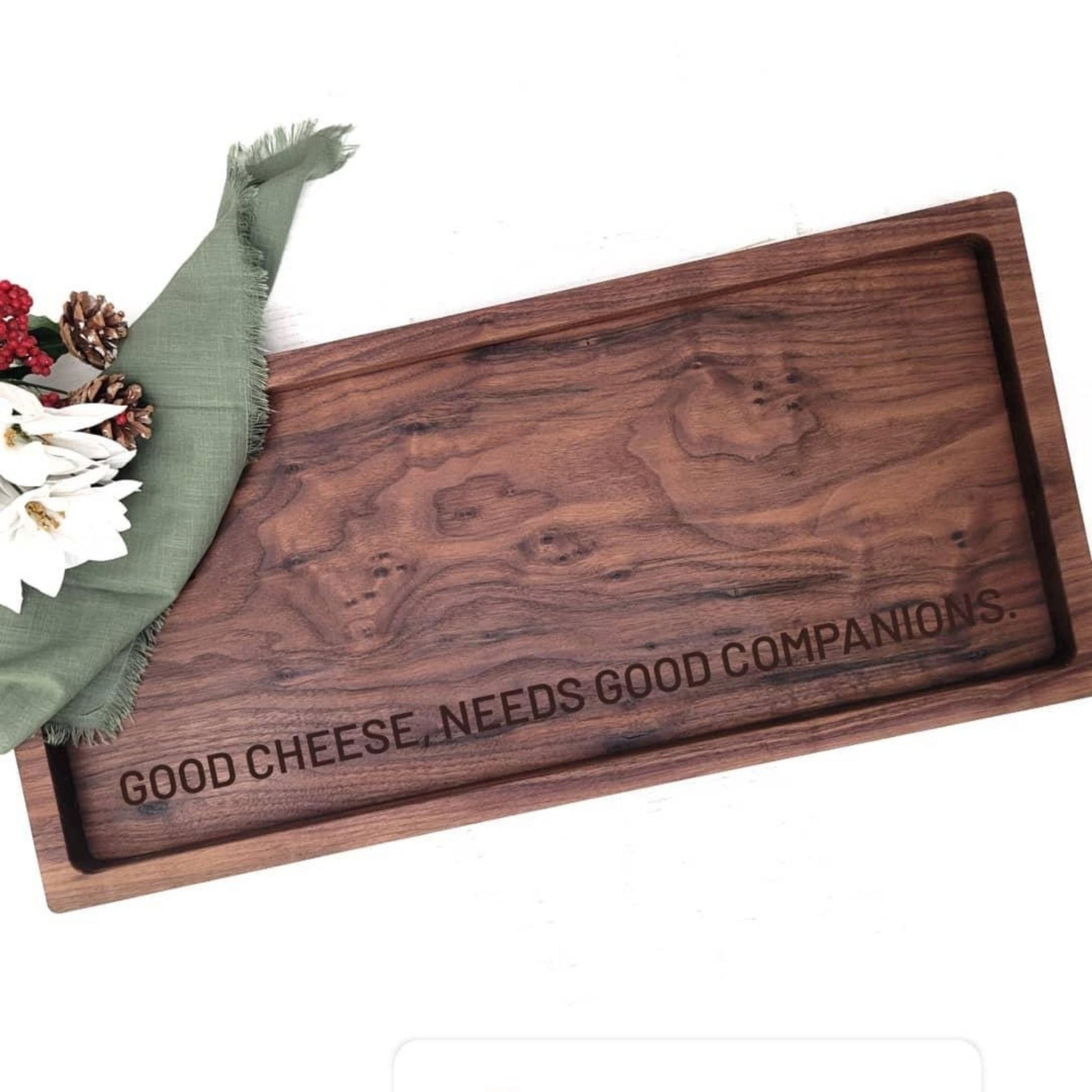 large walnut charcuterie board personalized with a custom message