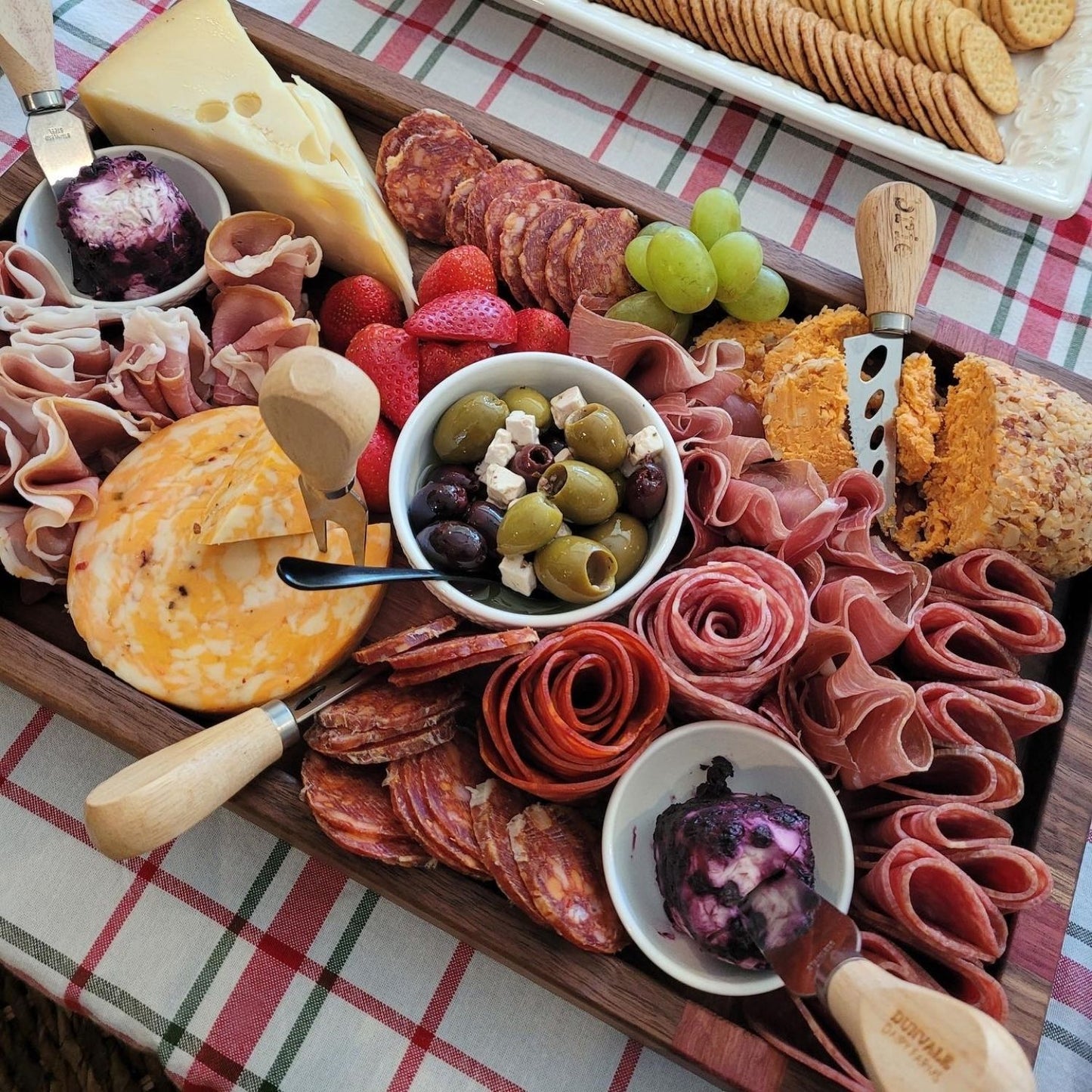 handcrafted charcuterie board, highlighting its intricate wood grain and meticulous craftsmanship. The board's edges are smooth, adding a touch of sophistication to any dining experience.