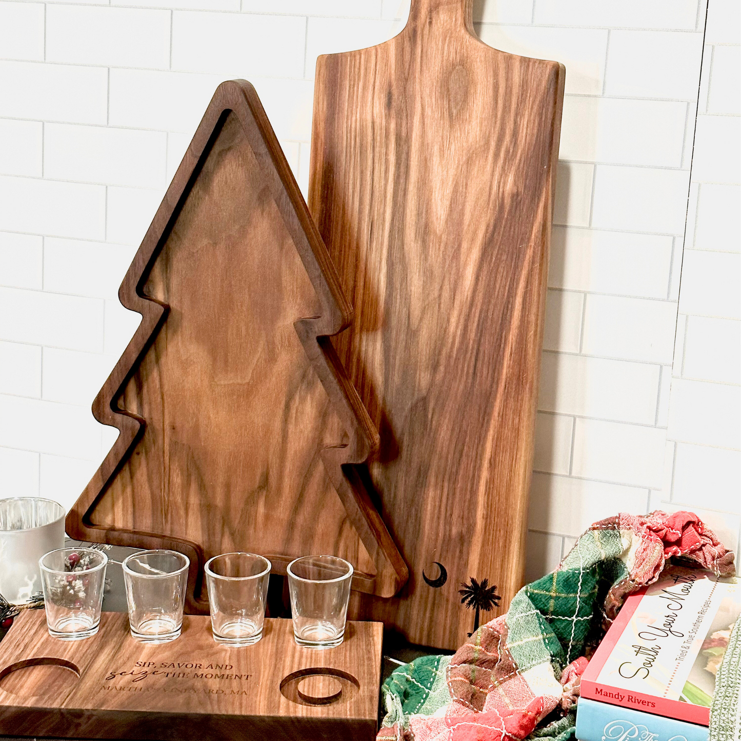 Christmas tree shaped charcuterie board, leaning on wood paddle cutting board