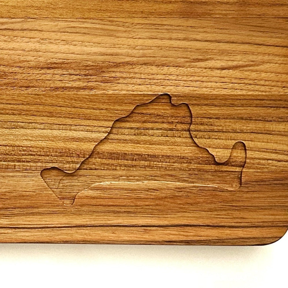 Close-up of the Martha's Vineyard engraved on the corner of a teakwood cutting board