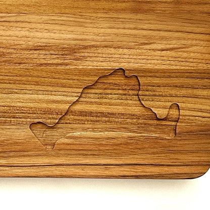 Close-up of the Martha's Vineyard engraved on the corner of a teakwood cutting board