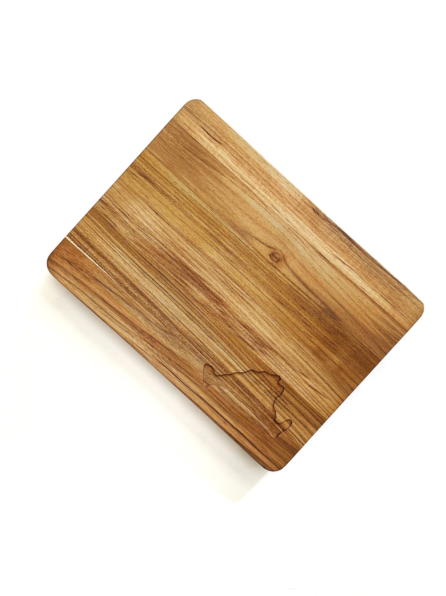 Teakwood cutting board with the Martha's Vineyard shape engraved on the corner