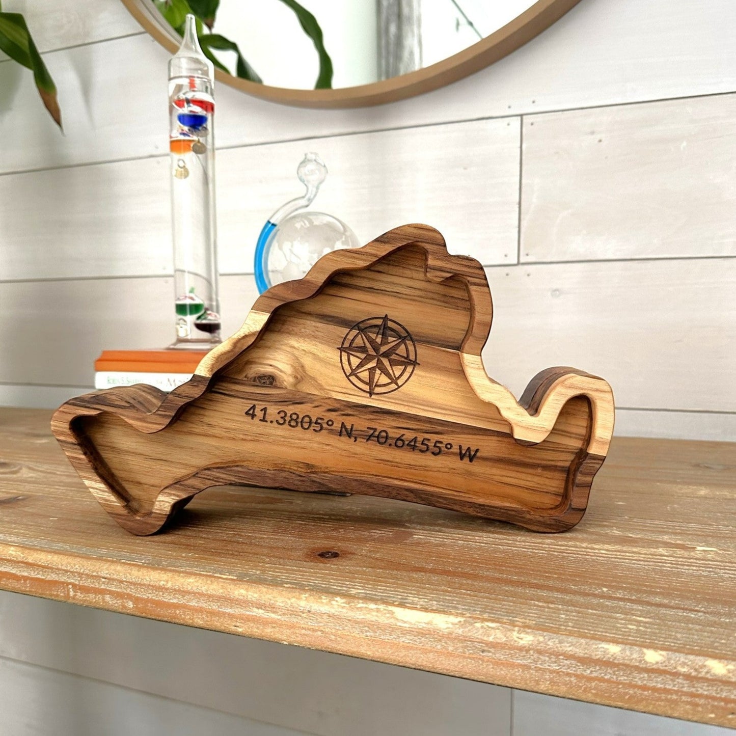 A captivating Martha's Vineyard shaped charcuterie board with coordinates engraved
