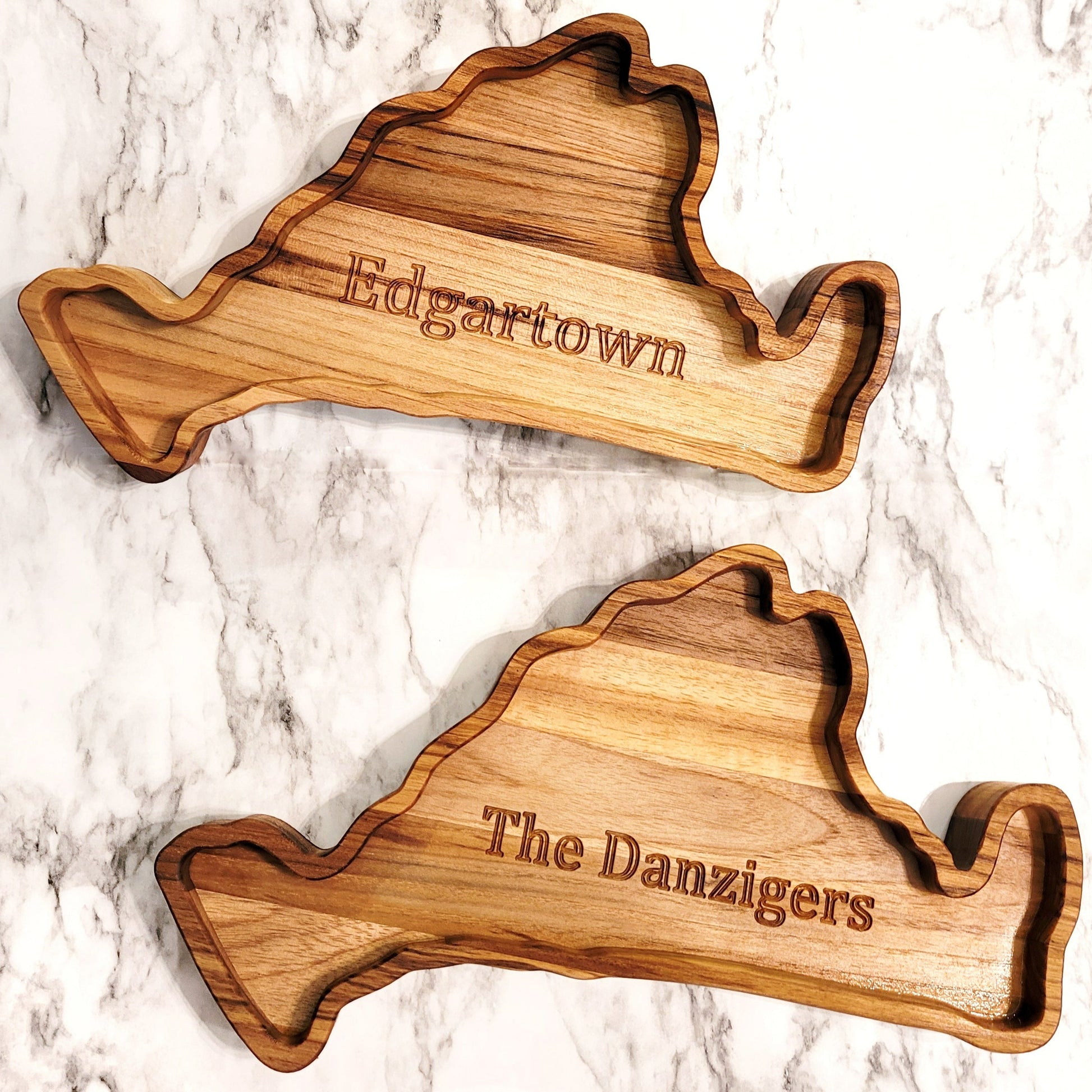 Two Martha's Vineyard charcuterie boards, one personalized with Edgartown and the other with a family's last name