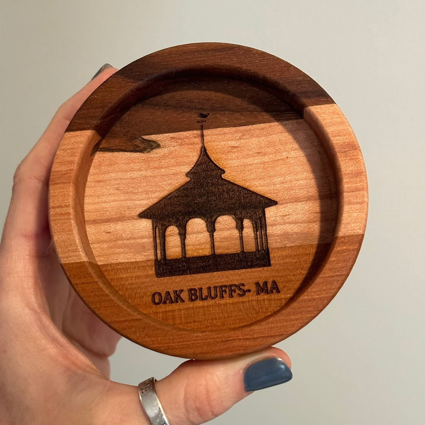 wooden wine coaster with intricate engraving of Oak Bluffs gazebo