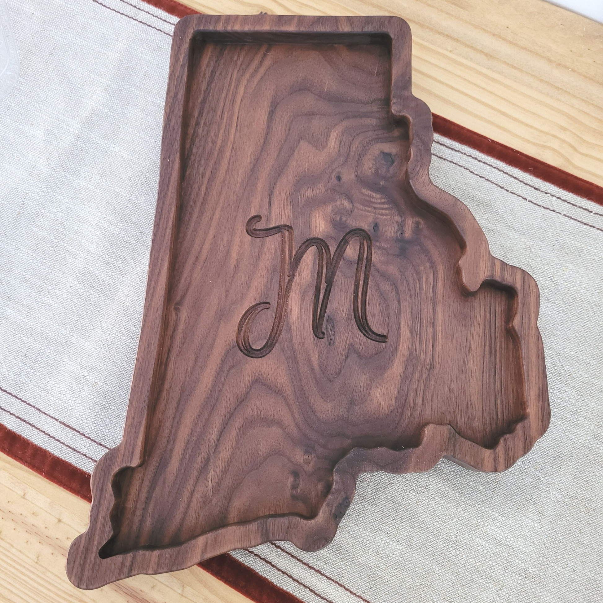 Rhode Island shaped charcuterie board made of walnut and engraved with initial