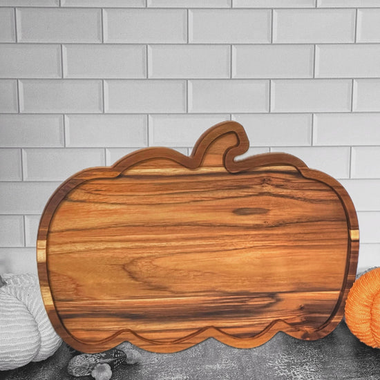 pumpkin-shaped wooden charcuterie board for fall, seasonal pumpkin charcuterie tray, autumn-themed serving board