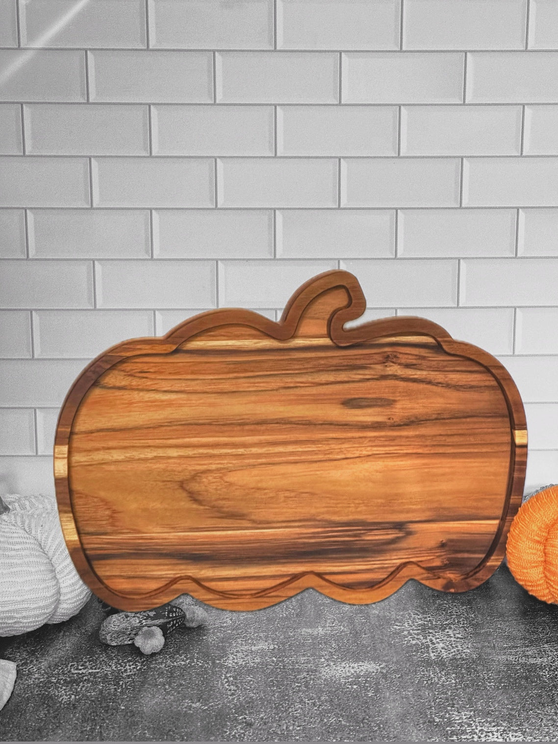 pumpkin-shaped wooden charcuterie board for fall, seasonal pumpkin charcuterie tray, autumn-themed serving board