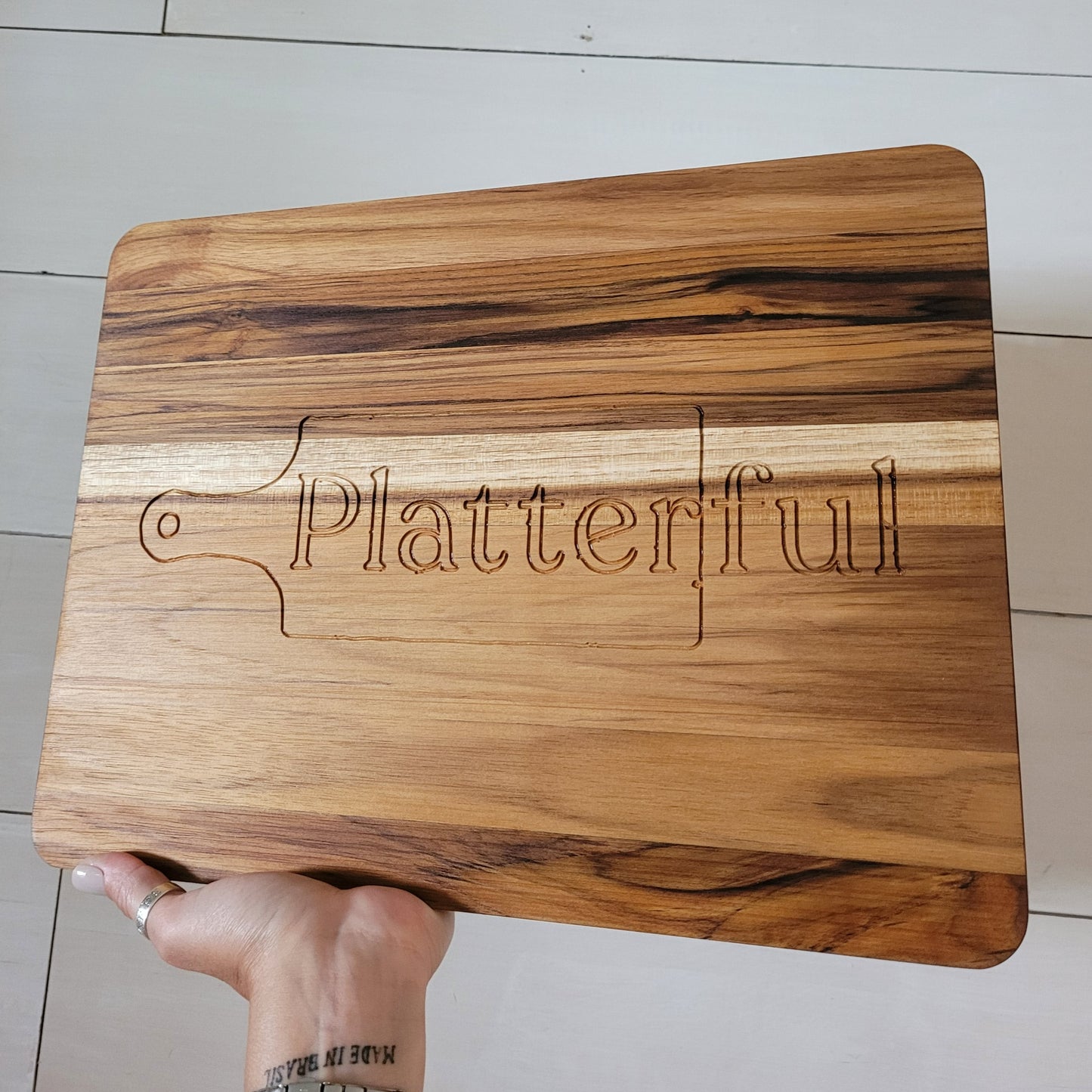 teakwood cutting board personalized with platterful logo
