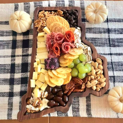 Rhode Island state-shaped wooden charcuterie board boasting a delicious arrangement of artisanal cheeses, grapes, and nuts