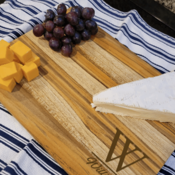 cutting board made of teak, used as cheese board