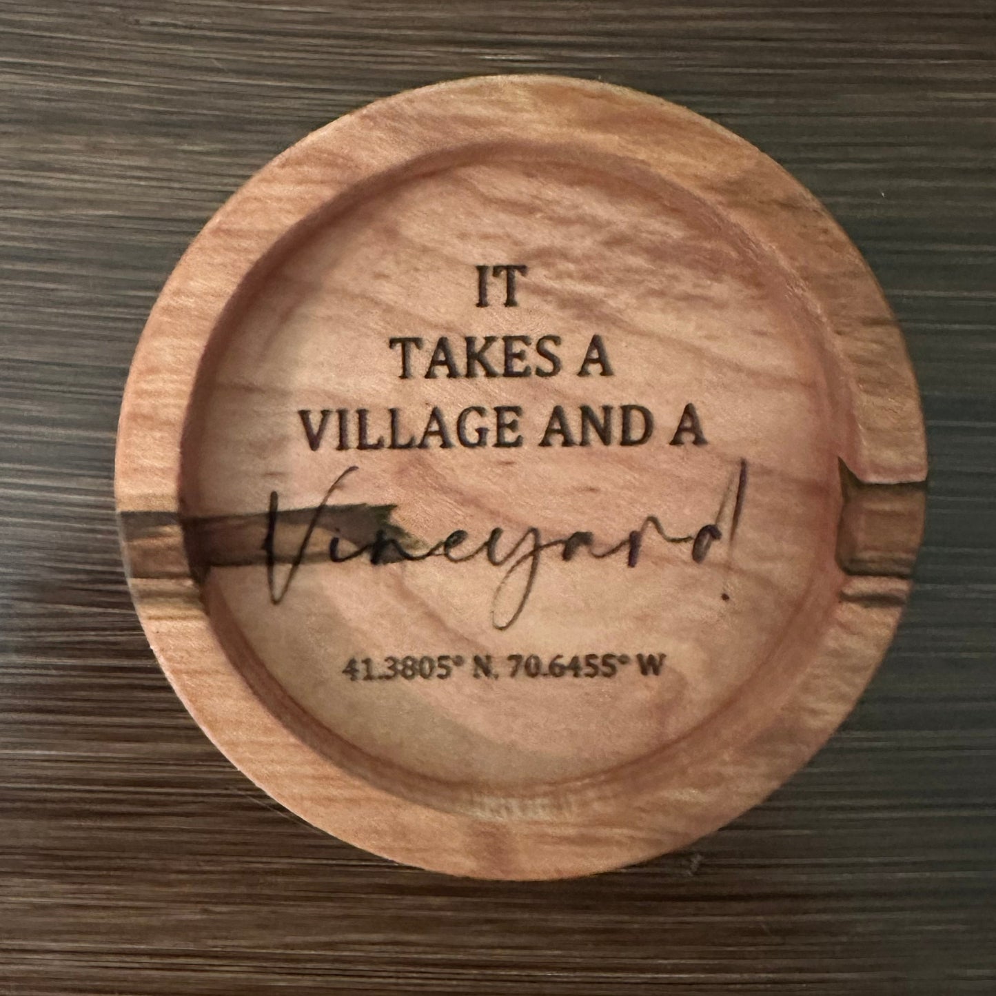 Close-up of rustic wooden charcuterie bowl featuring intricate engraving of Martha's Vineyard 