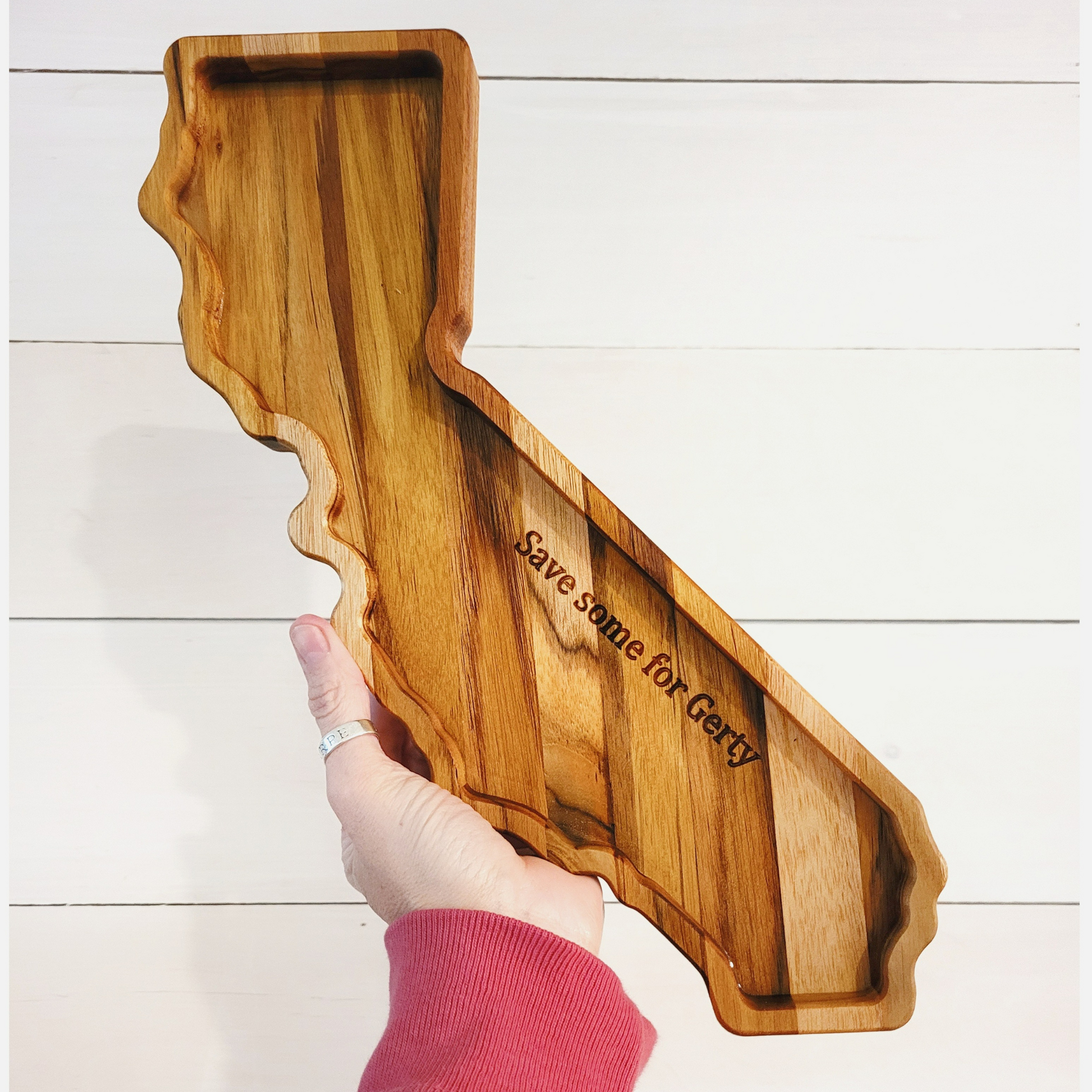 State-shaped wooden charcuterie board showcasing California, with a fun message engraved, a perfect centerpiece for entertaining
